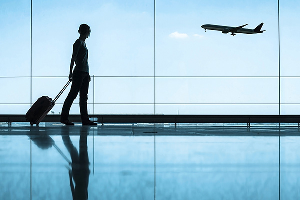 traveler walking inside the airport