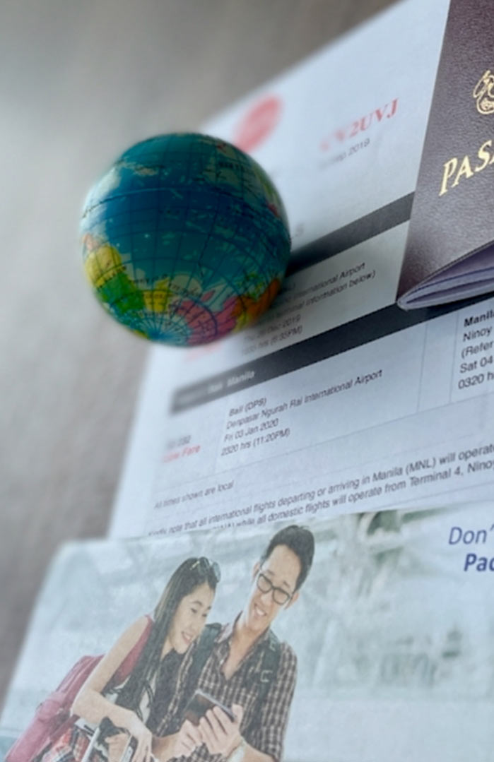 travel documents including passport, airline ticket, insurance policy